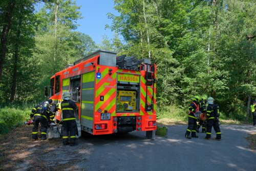 Požár lesa v areálu s výbušninami