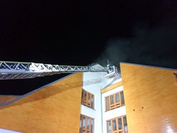 Požár v podkroví výškové budovy